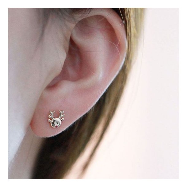 Donnatella reringe forgyldt med juletr og elg